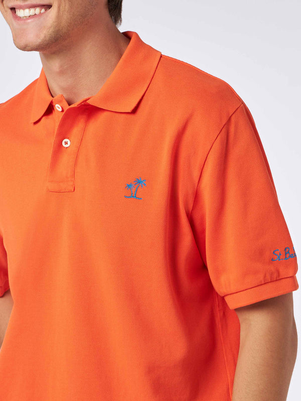 Man orange piquet polo with St. Barth logo and vintage effect