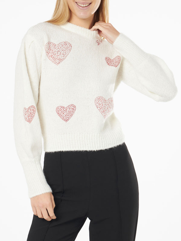Woman brushed white sweater with rhinestones hearts