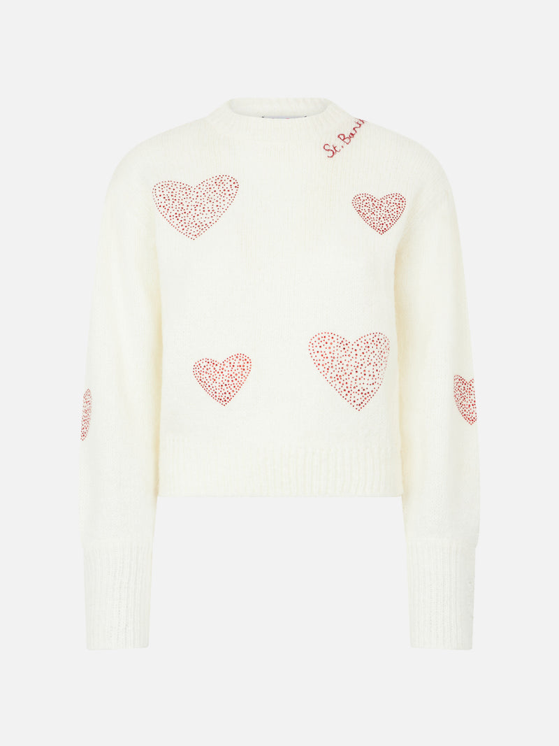 Woman brushed white sweater with rhinestones hearts