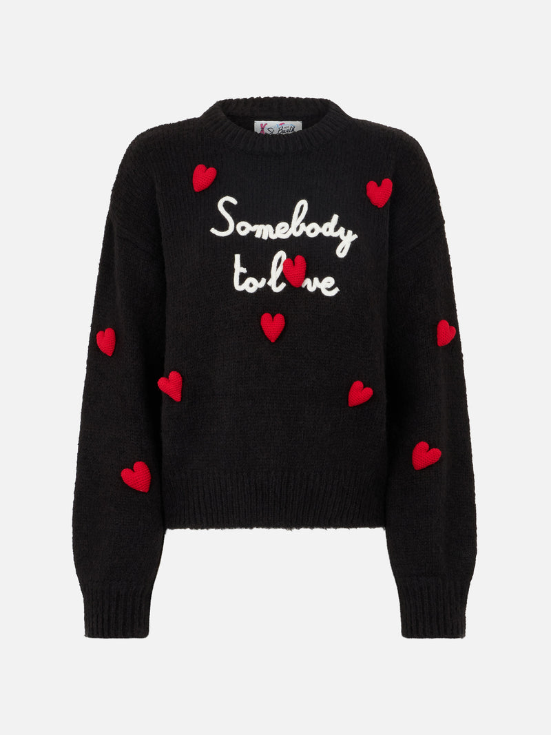 Woman boxy shape soft sweater with Somebody to Love embroidery and crochet hearts patch