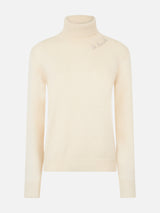 Woman knitted off white turtleneck sweater