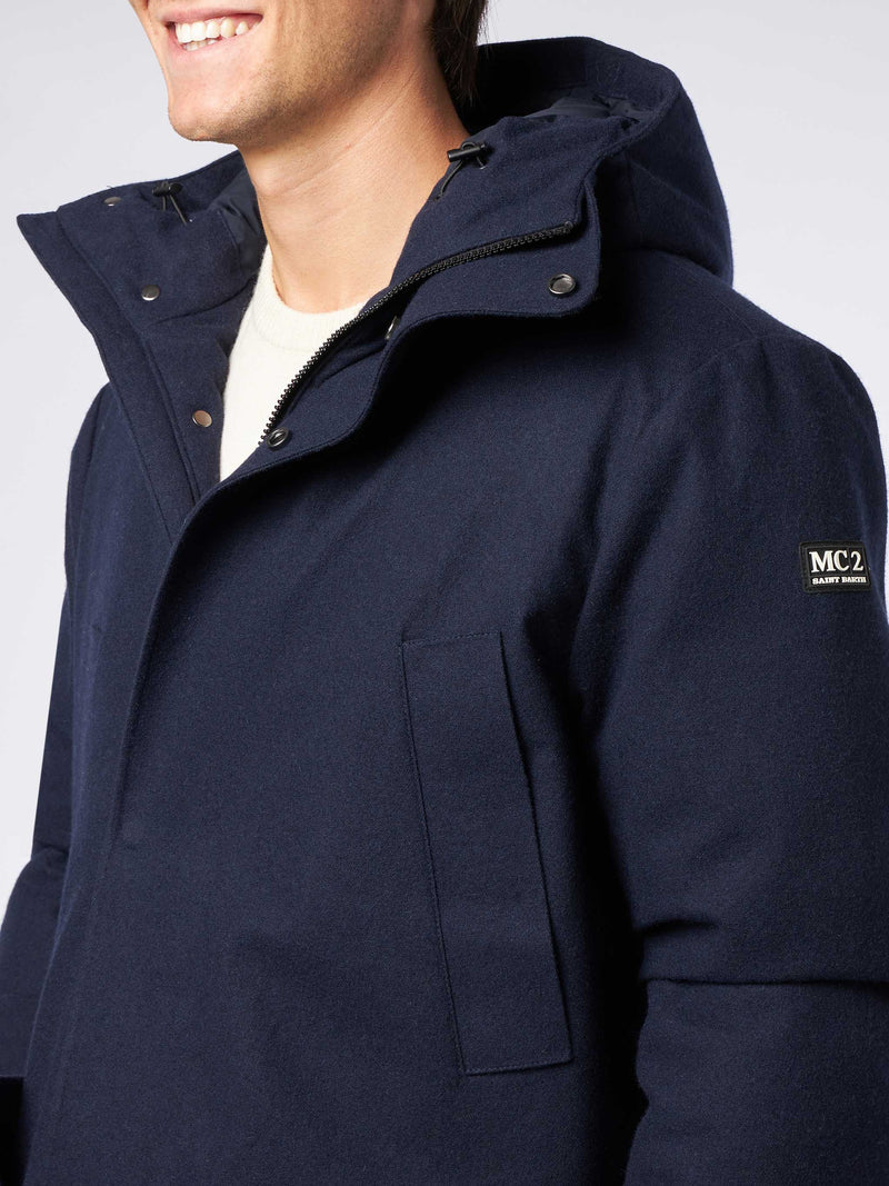 Man hooded blue parka jacket