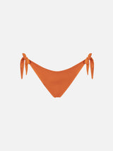 Woman orange swim briefs with side laces