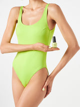 Woman lime one piece swimsuit