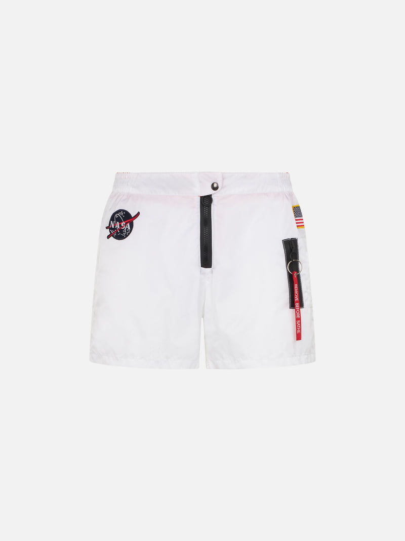 White swim shorts with patches