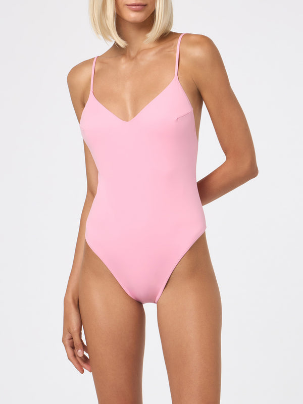 Woman pink one piece swimsuit