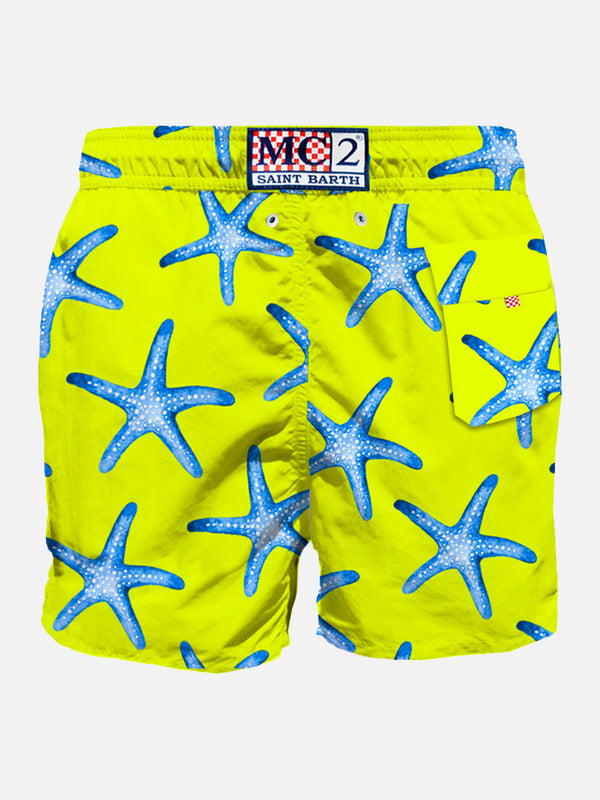 Yellow  mid-length swim shorts with sea star