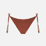 Woman brown terry swim briefs with charms