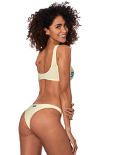 Woman yellow bralette bikini with glitter logo
