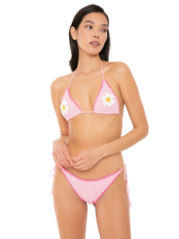Woman crochet triangle bikini with daisy patch
