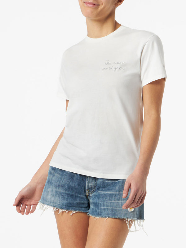 Woman T-shirt with The Snow must go on lettering