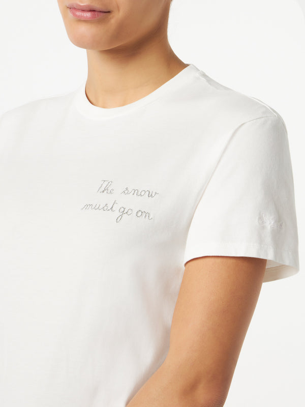 Woman T-shirt with The Snow must go on lettering