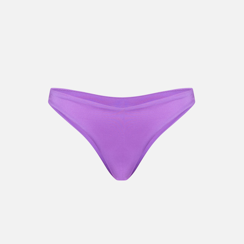 Woman shiny purple cheeky swim briefs