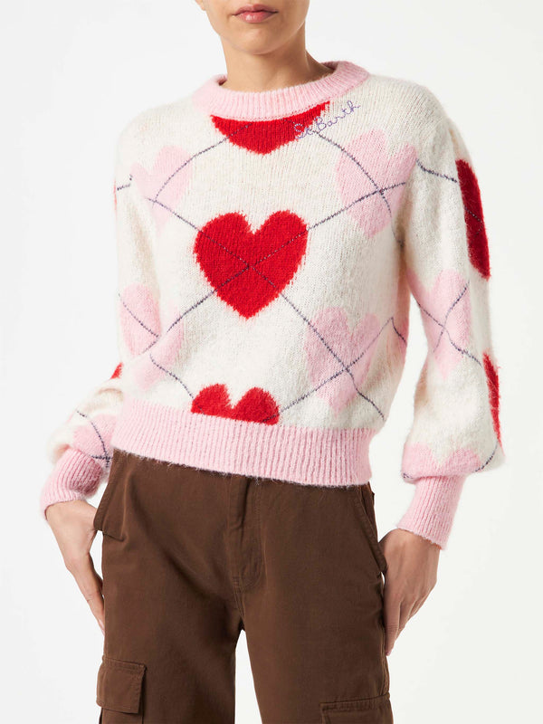 Woman brushed striped sweater with heart pattern