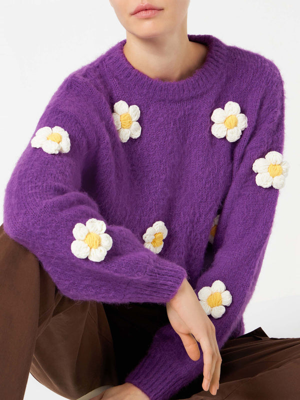 Woman brushed crewneck sweater with daisy appliqué
